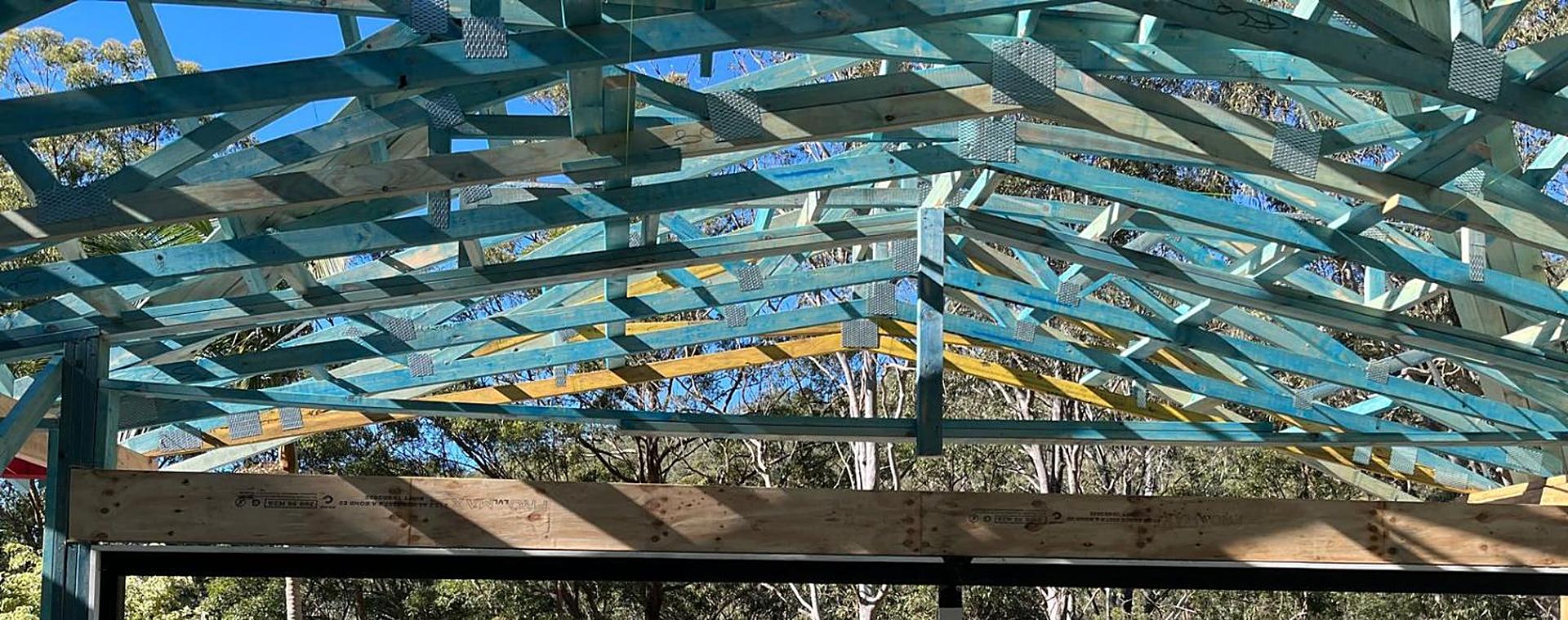 Hip roof trusses over an LVL lintel on a bushland block
