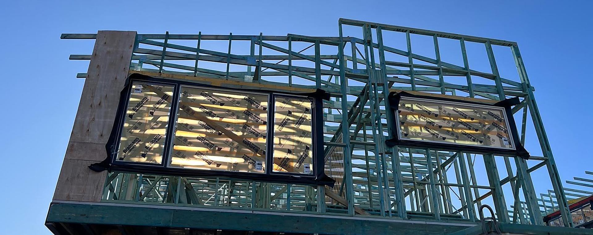 Upper-storey timber wall frames with the windows in