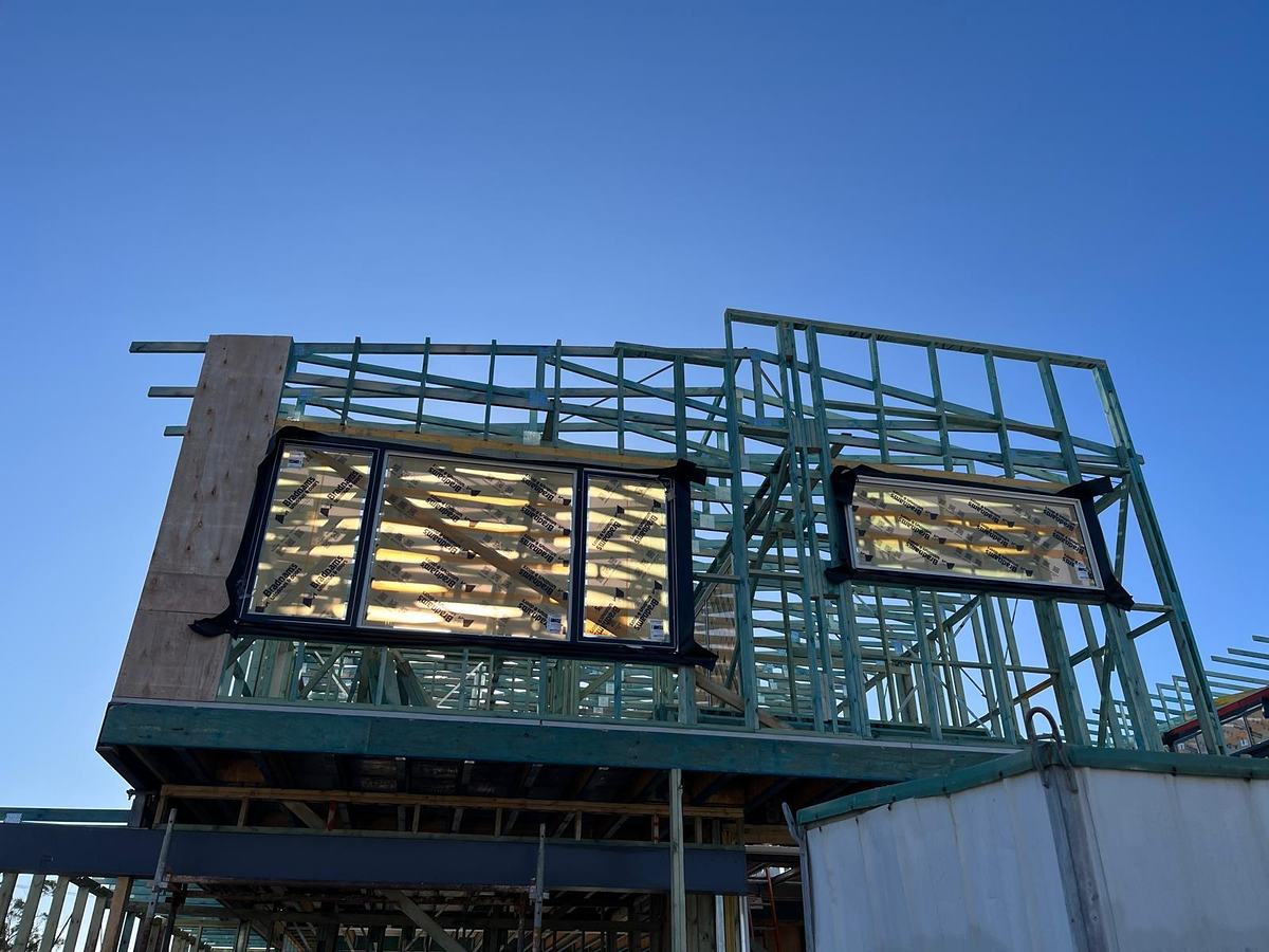 Upper-storey timber wall frames with the windows in