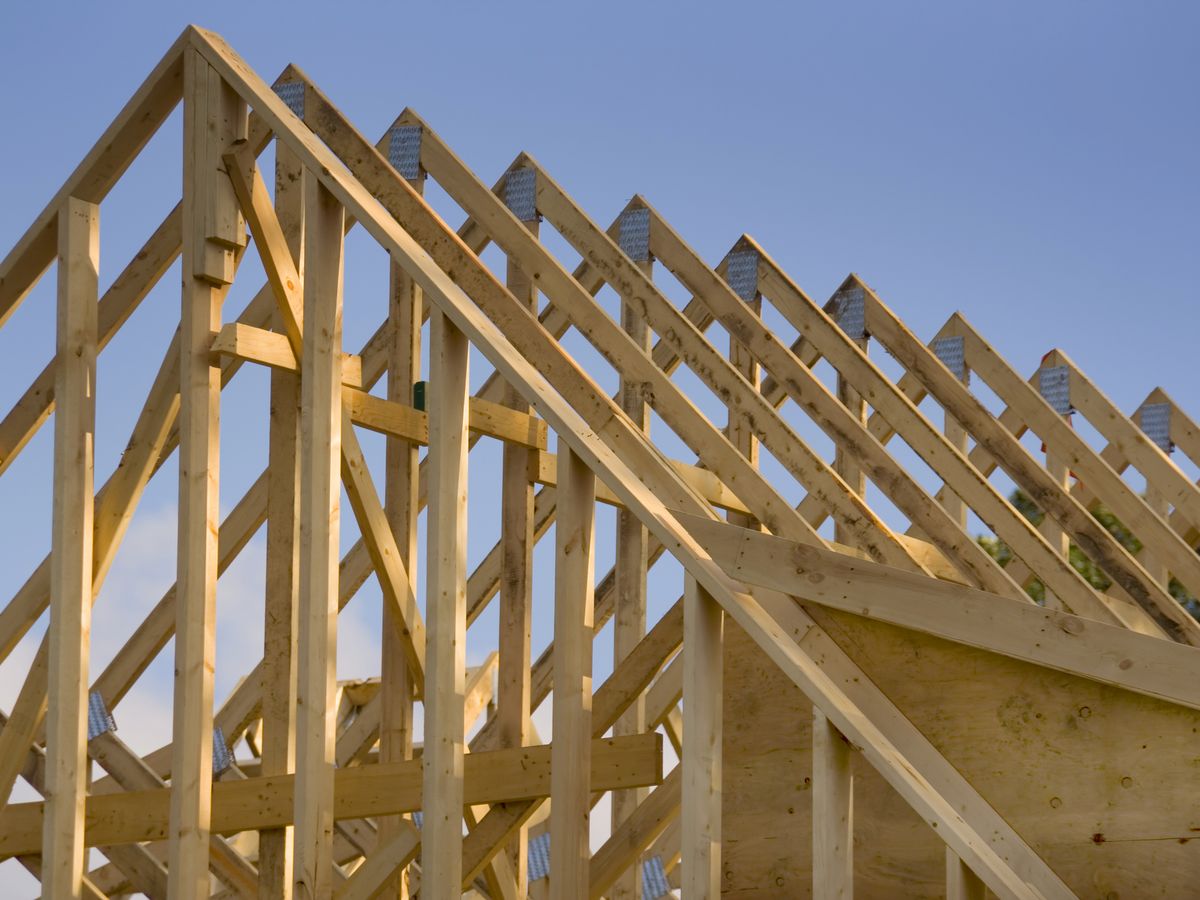 Timber roof trusses on a house frame